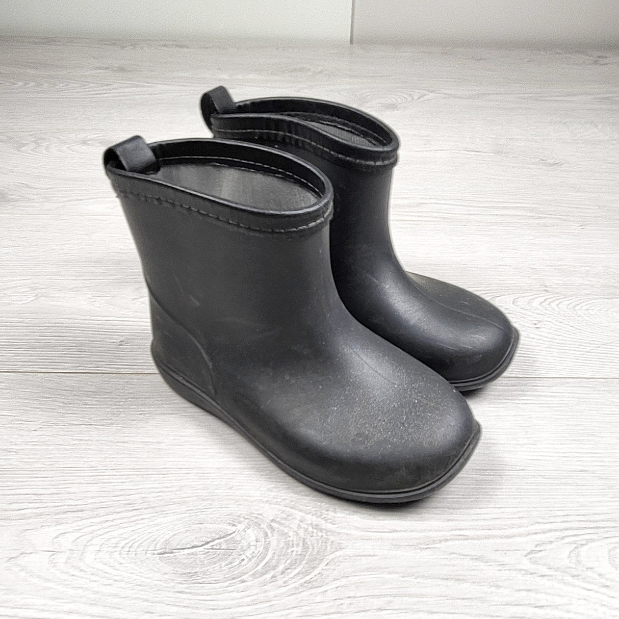 Black shorter style rain boots. Size like an 11