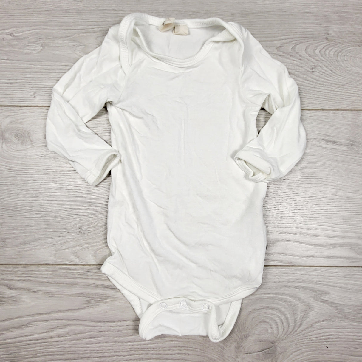 Kyte Baby white bamboo bodysuit. Size 3-6 months