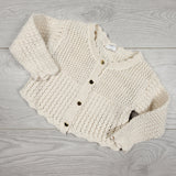 H and M cream coloured knit sweater with heart buttons. Size 6-12 months