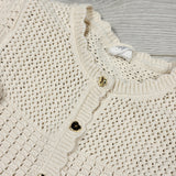 H and M cream coloured knit sweater with heart buttons. Size 6-12 months