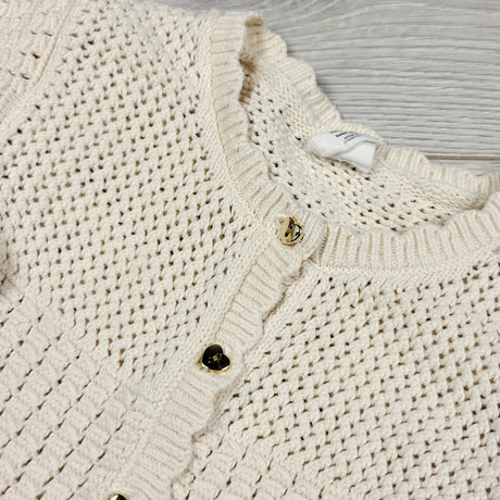 H and M cream coloured knit sweater with heart buttons. Size 6-12 months