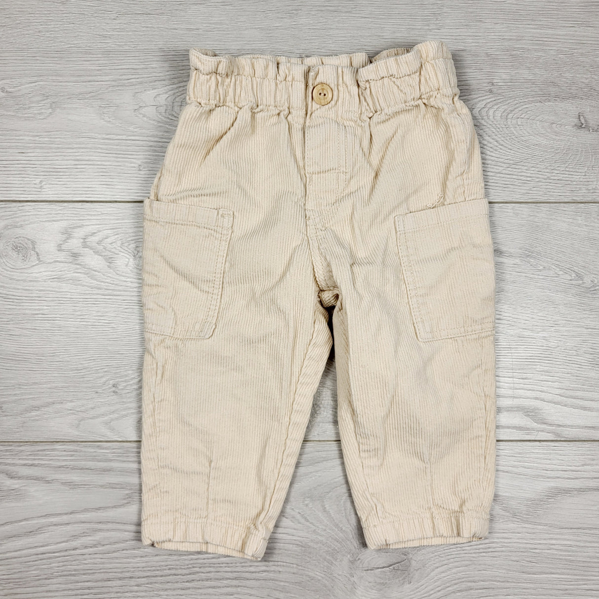 H and M peachy-beige corduroy pants with ruffle waist. Size 6-9 months