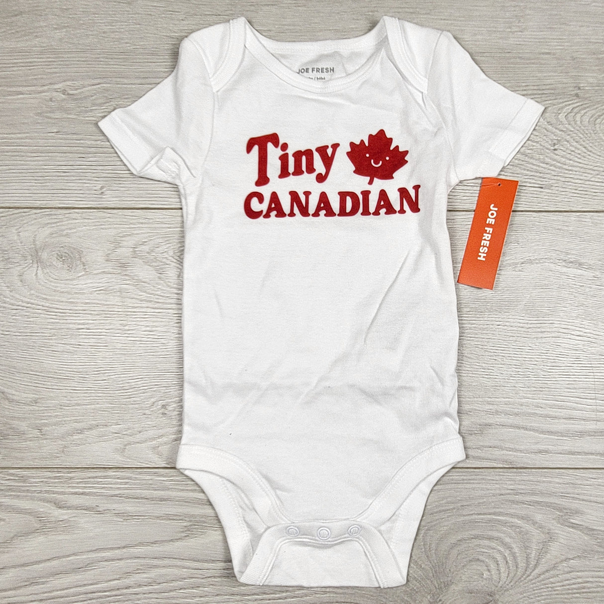NEW - Joe white "Tiny Canadian" bodysuit. Size 6-12 months