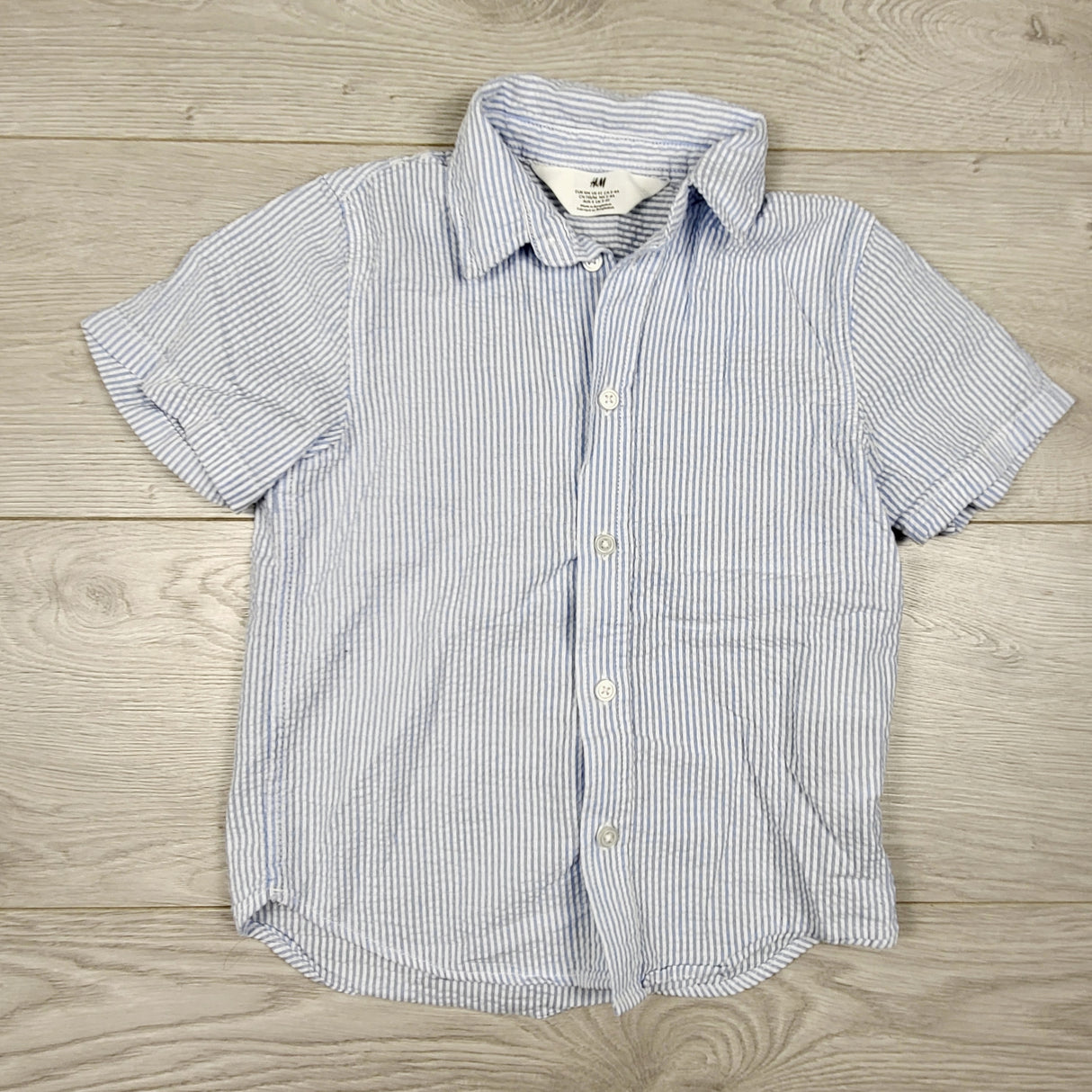 H and M blue pin striped button down shirt. Size 3/4T