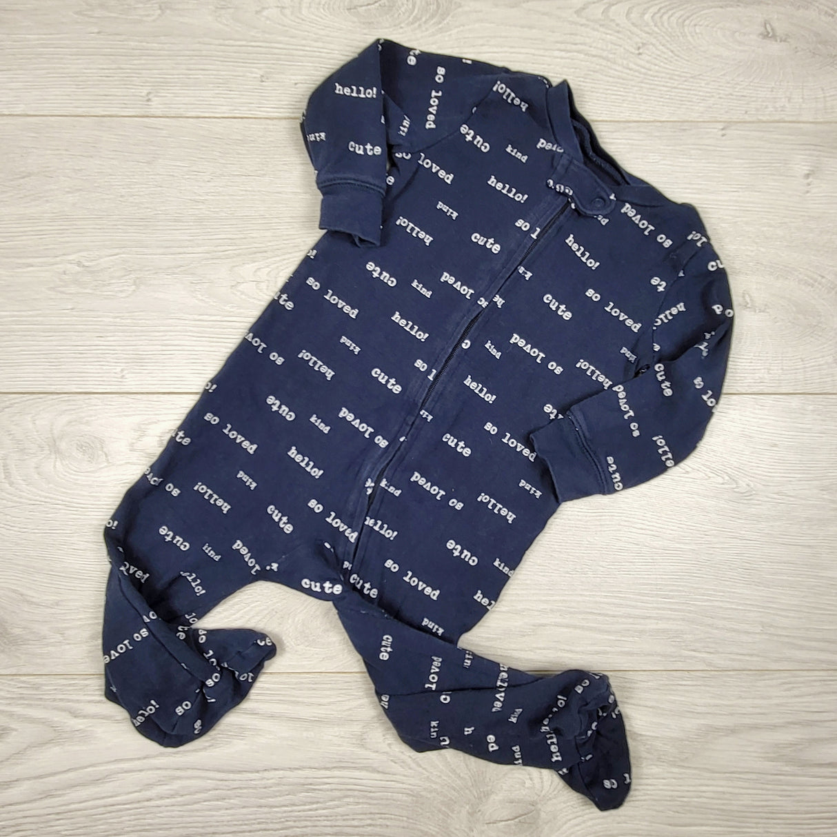 Carters navy zippered cotton sleeper with writing. Size 9 months
