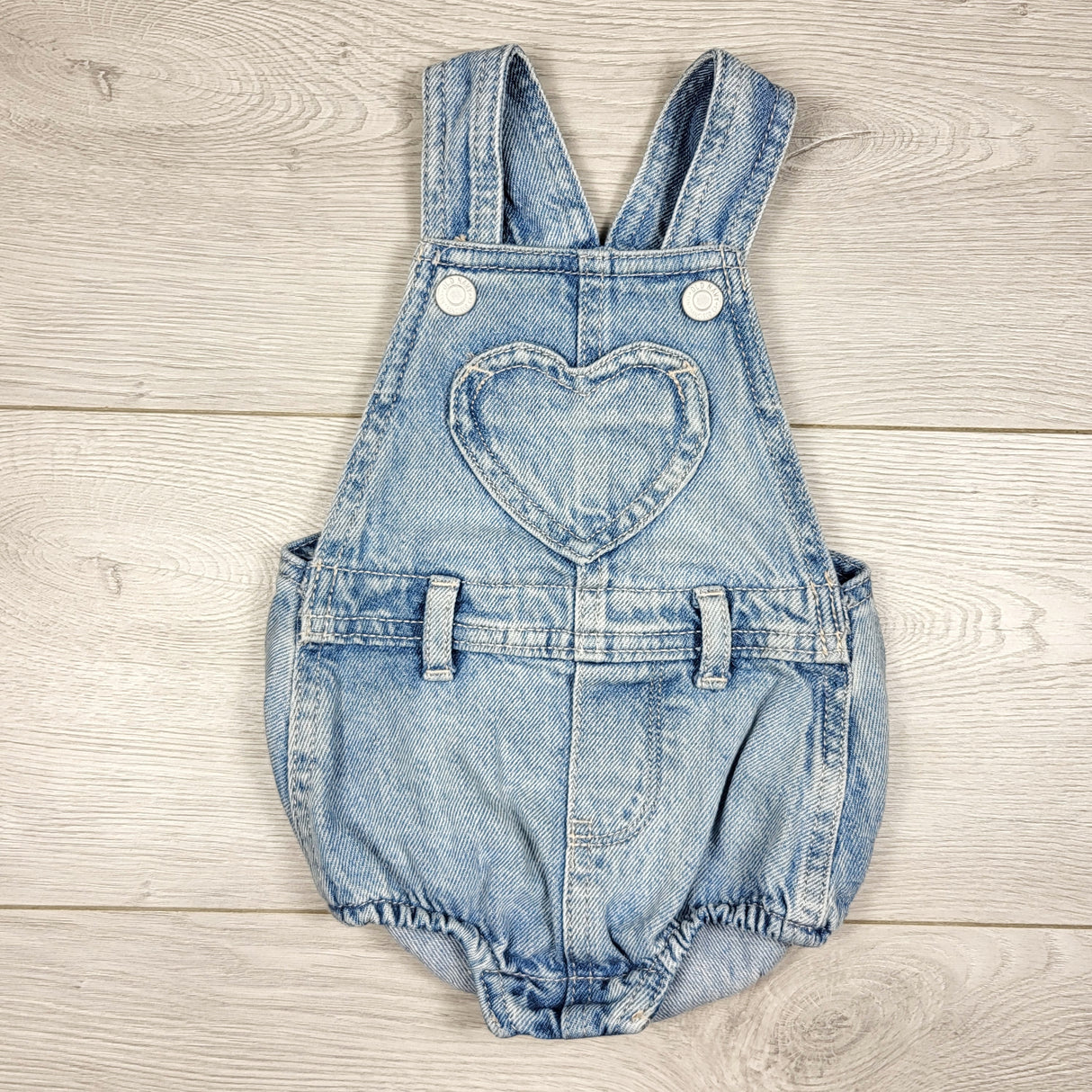 Old Navy denim bubble romper with heart pocket. Size 3-6 months