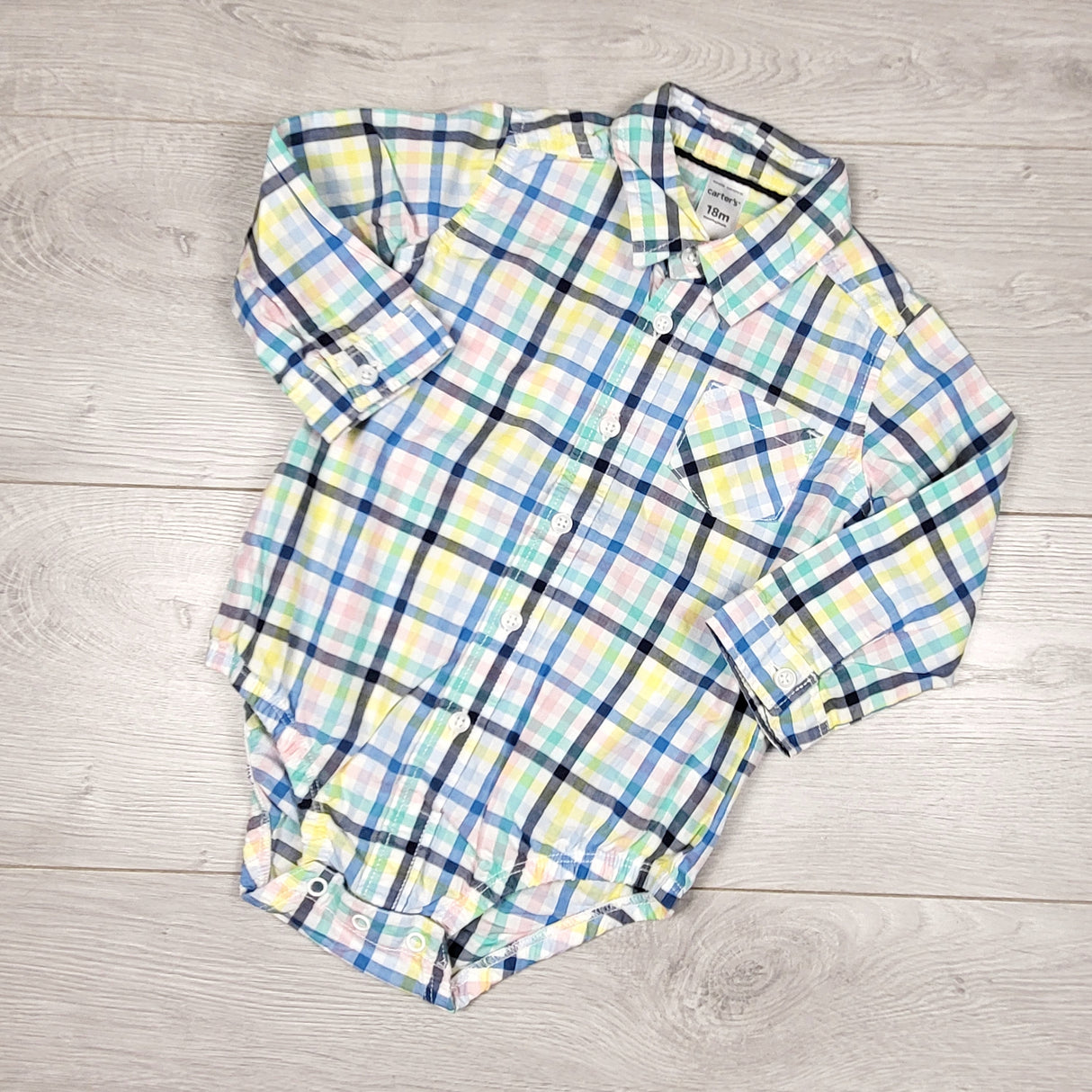 Carters multi-plaid button down bodysuit. Size 18 months