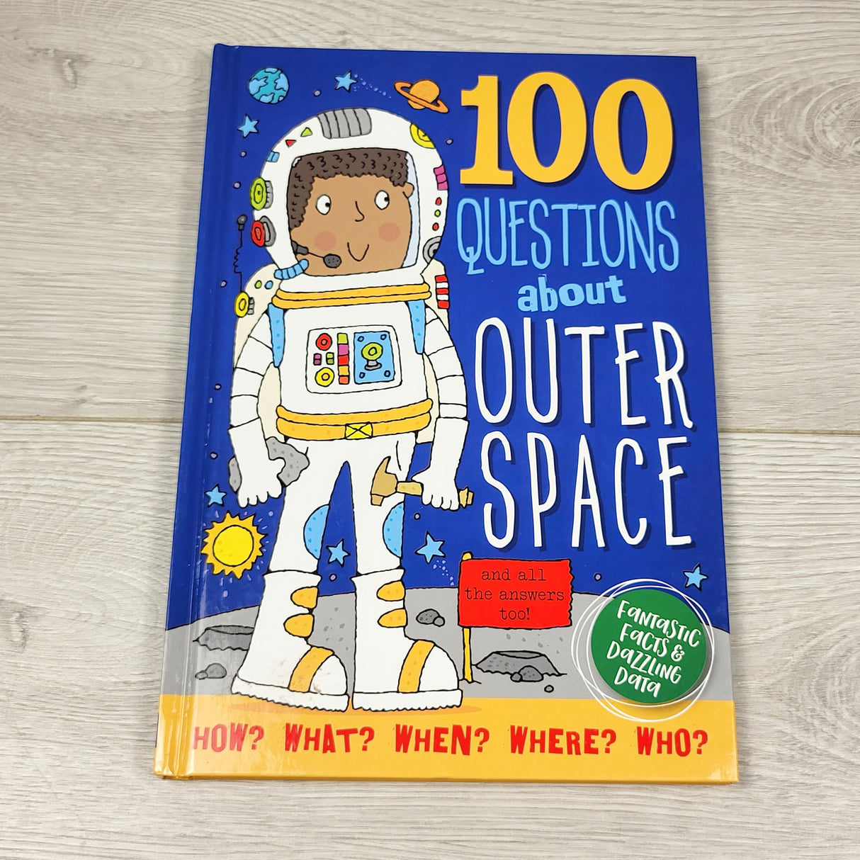 100 Questions About Outer Space. Hardcover book