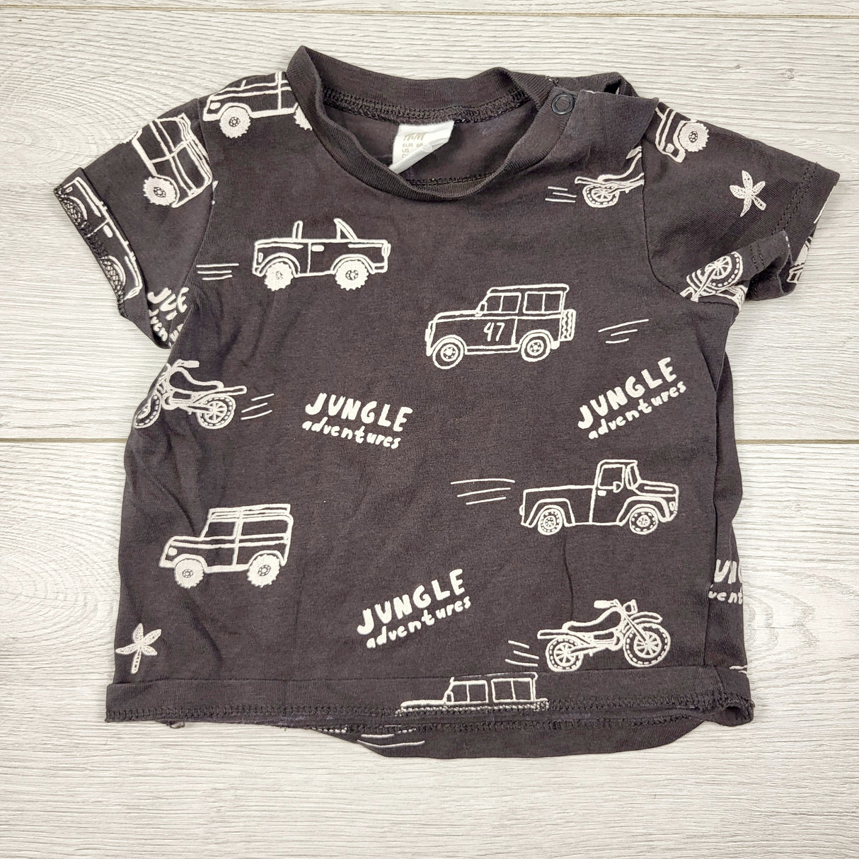 H and M dark grey t-shirt with jeeps. Size 4-6 months