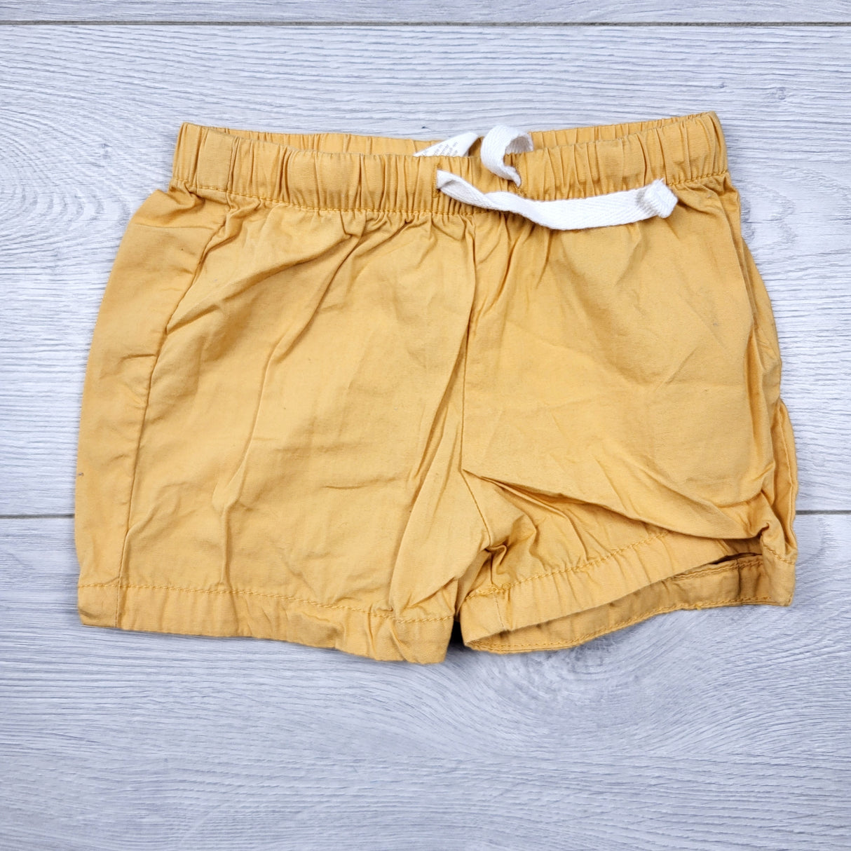 H and M golden yellow drawstring shorts. Size 4-6 months