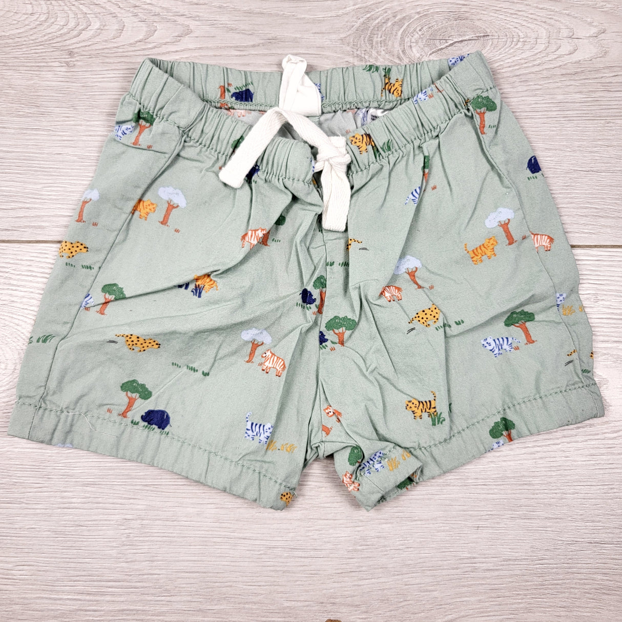 H and M green drawstring shorts with jungle animals. Size 4-6 months