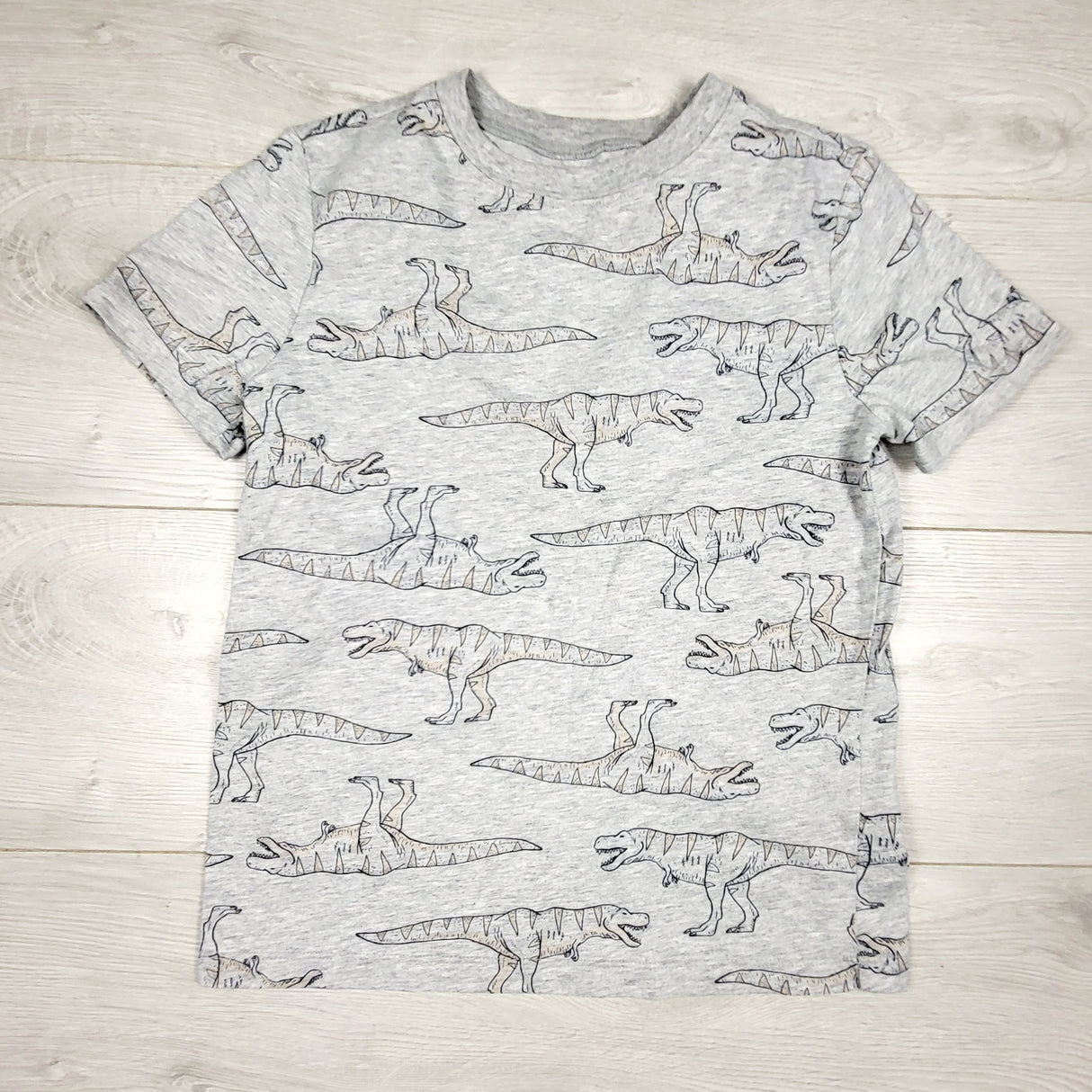 Old Navy grey t-shirt with dinosaurs. Size medium (8)