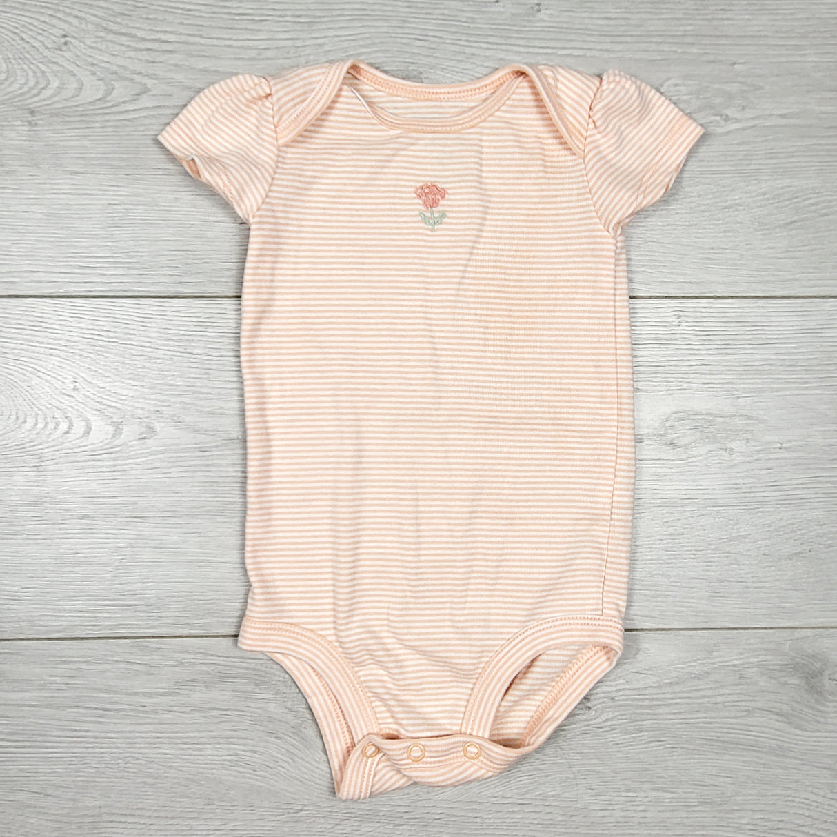 Child of Mine peach striped bodysuit with flower. Size 6-9 months