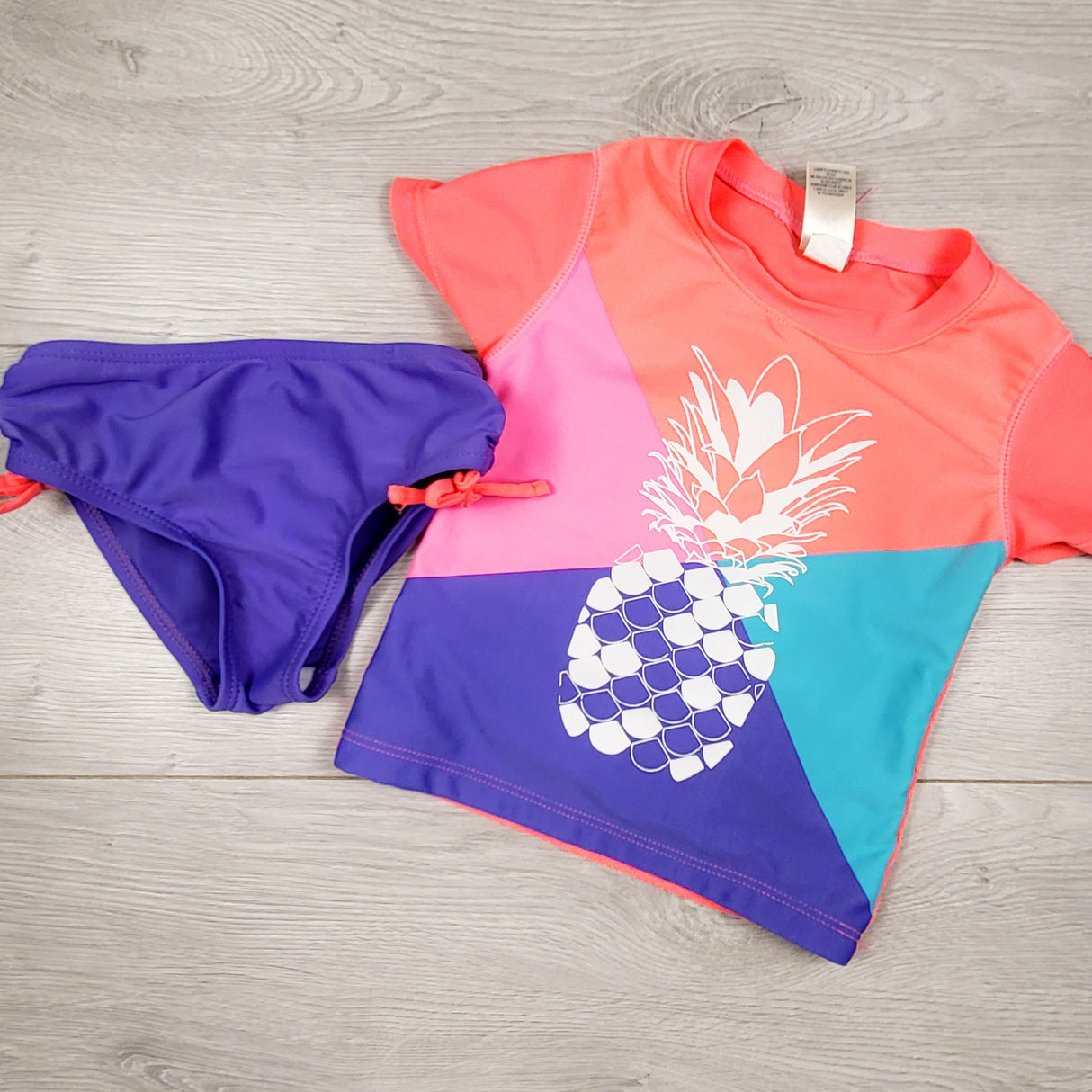 Oshkosh 2pc swimsuit with pineapple. Size 2T