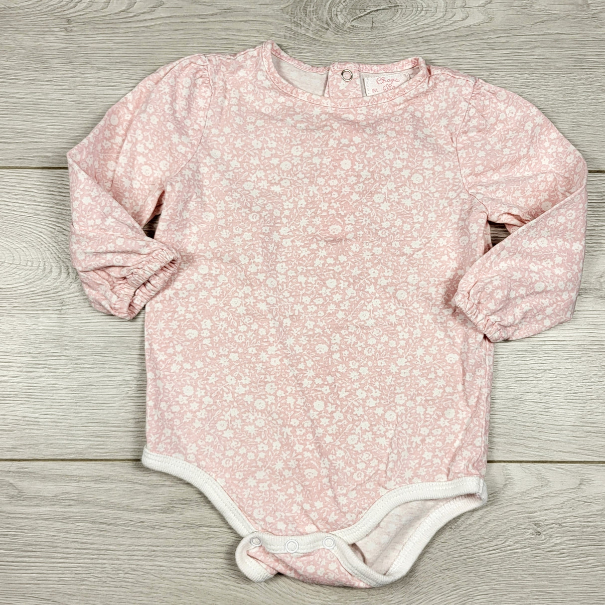 Chaps pink and white floral print bodysuit. Size 9 months