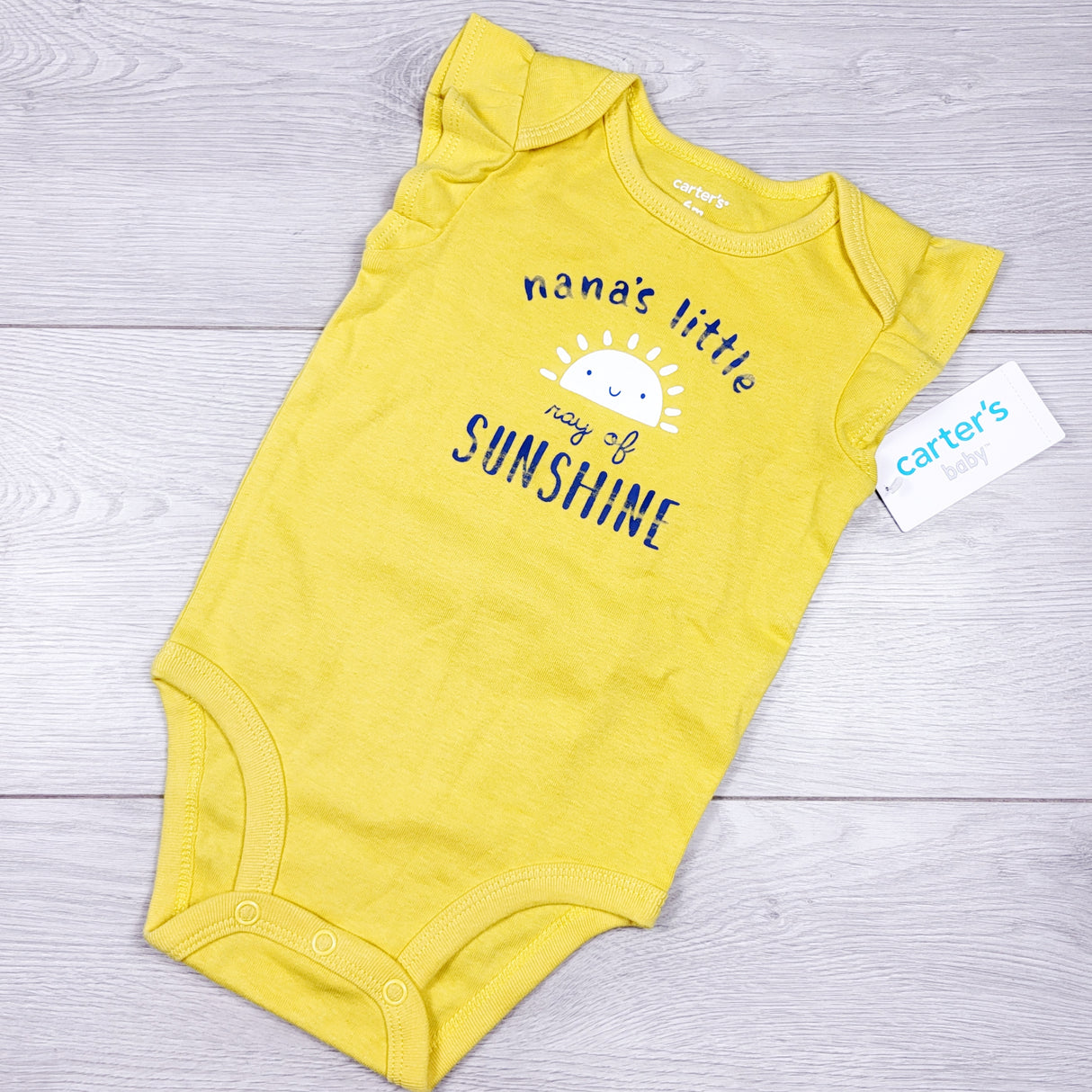 NEW - Carters yellow "Nana's Little Ray of Sunshine" bodysuit. Size 6 months