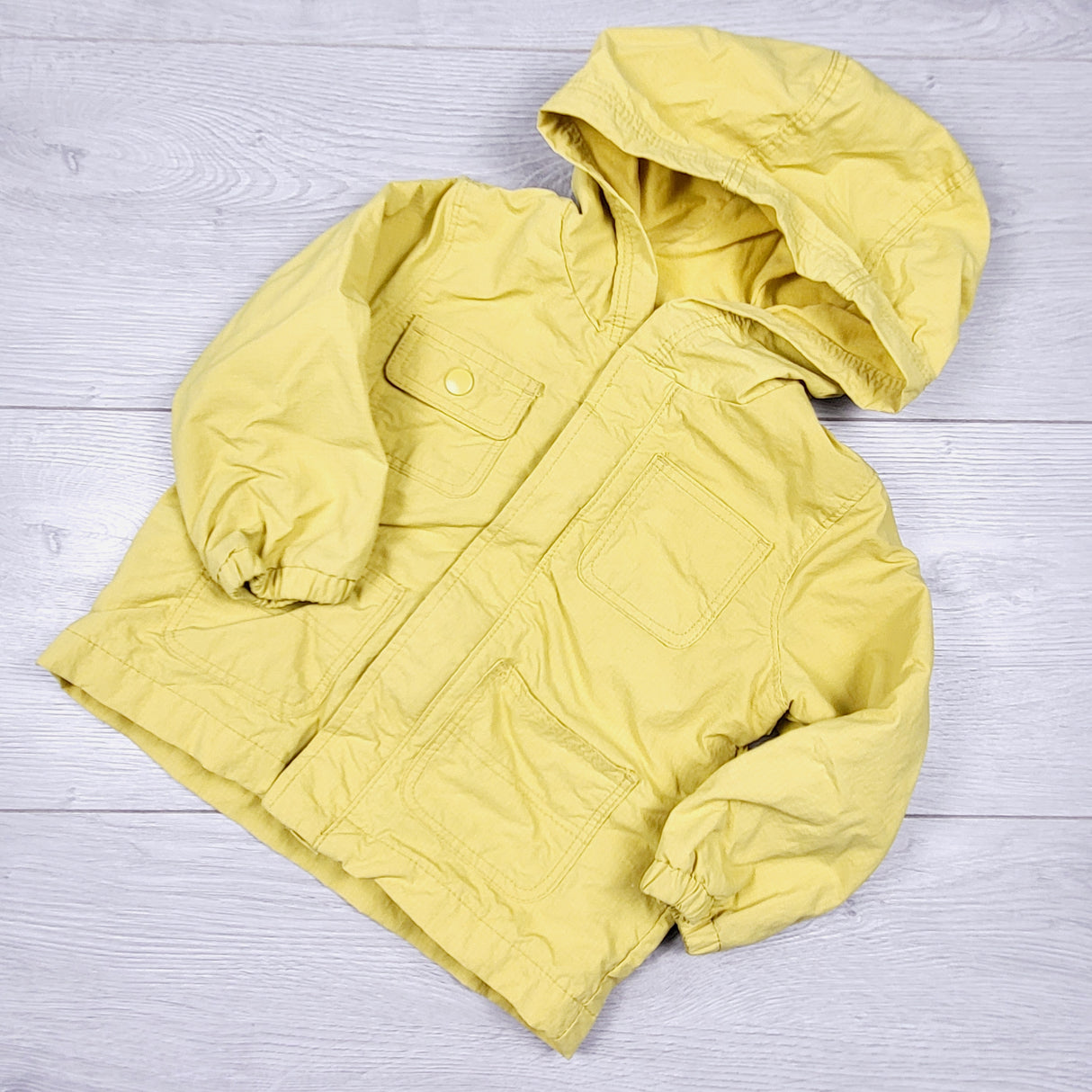 Old Navy yellow jersey lined rain coat. Size 12-18 months
