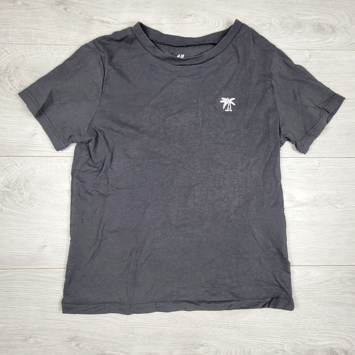 H and M dark grey t-shirt with palm tree. Size 8-10 Years