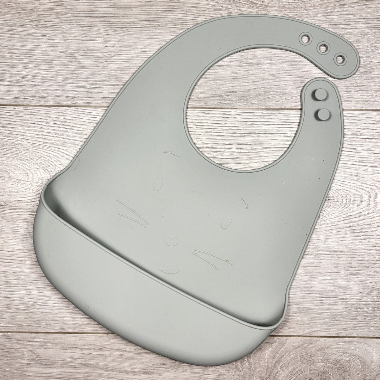 Sage green silicone bib with cat