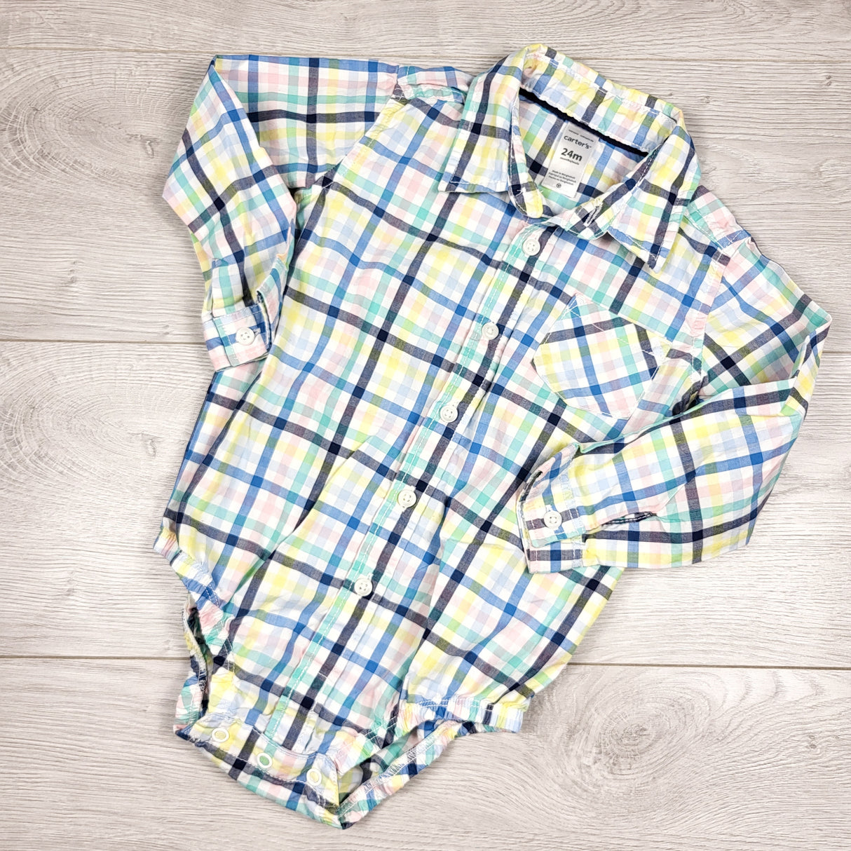 Carters multi-checked button down bodysuit. Size 24 months