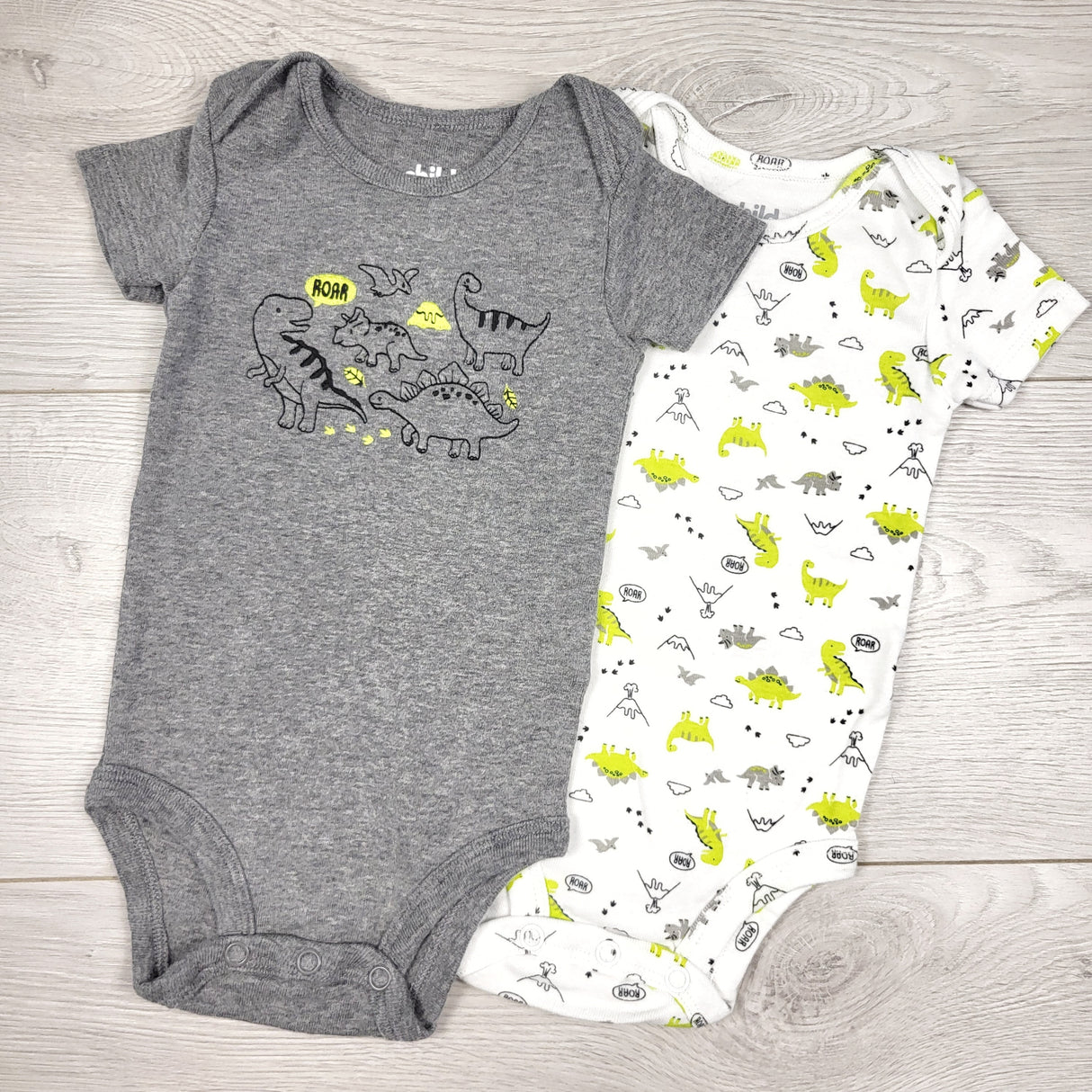 Child of Mine 2pc bodysuit set with dinosaurs. Size 0-3 months