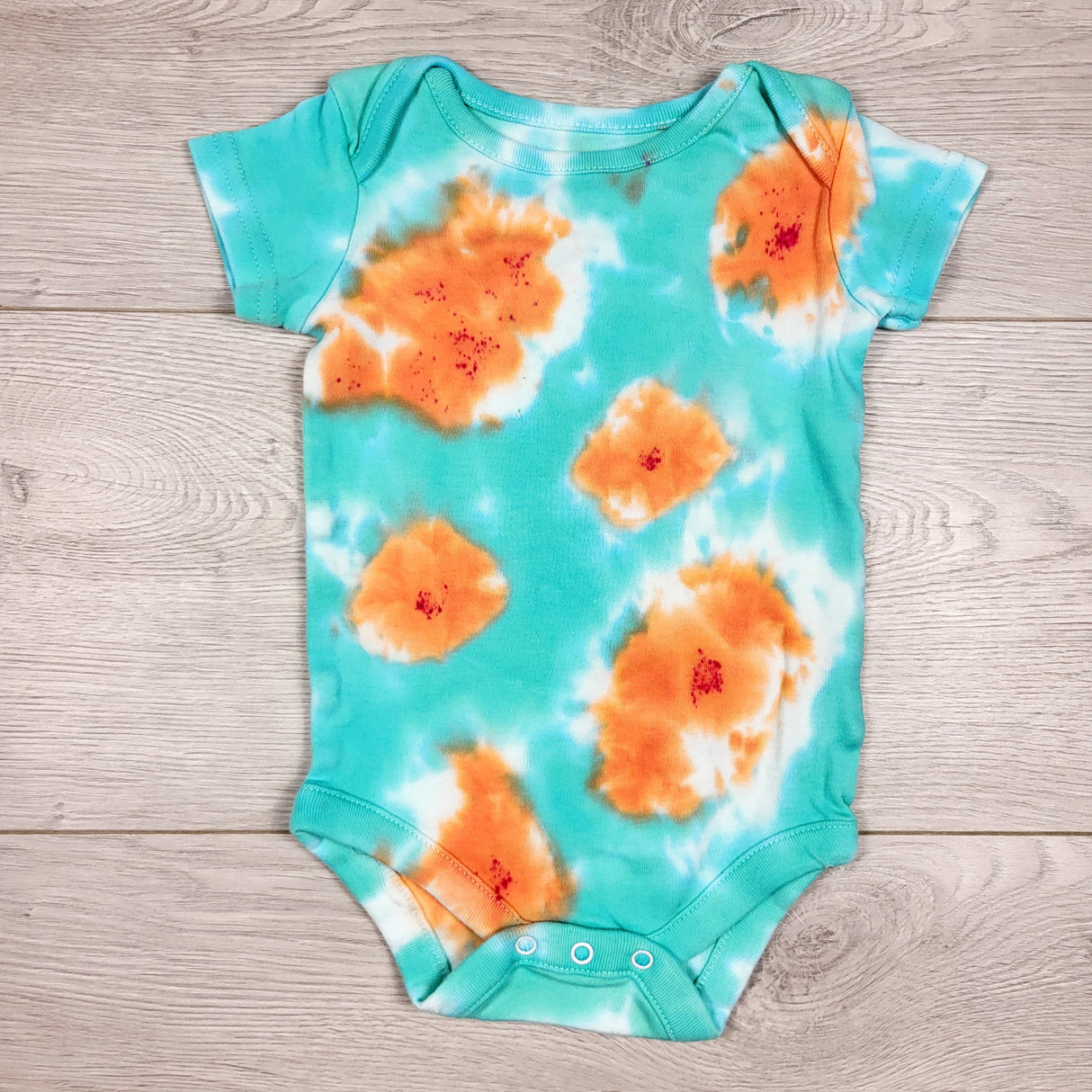 Turquoise and orange tie dyed bodysuit. Size 0-3 months