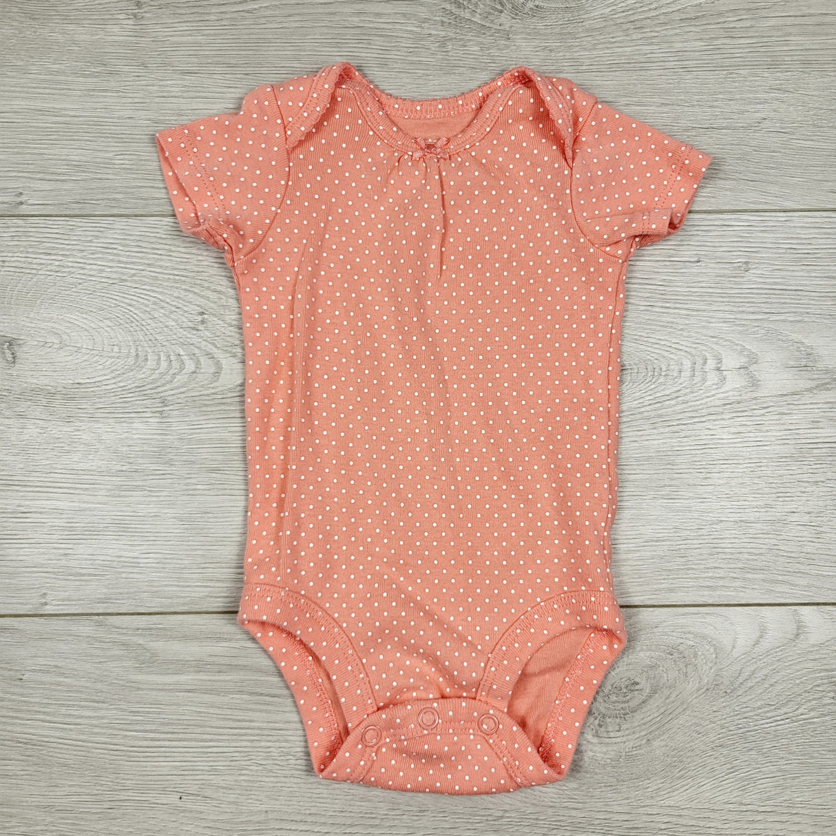 Carters coral polka dot bodysuit. Size 3 months