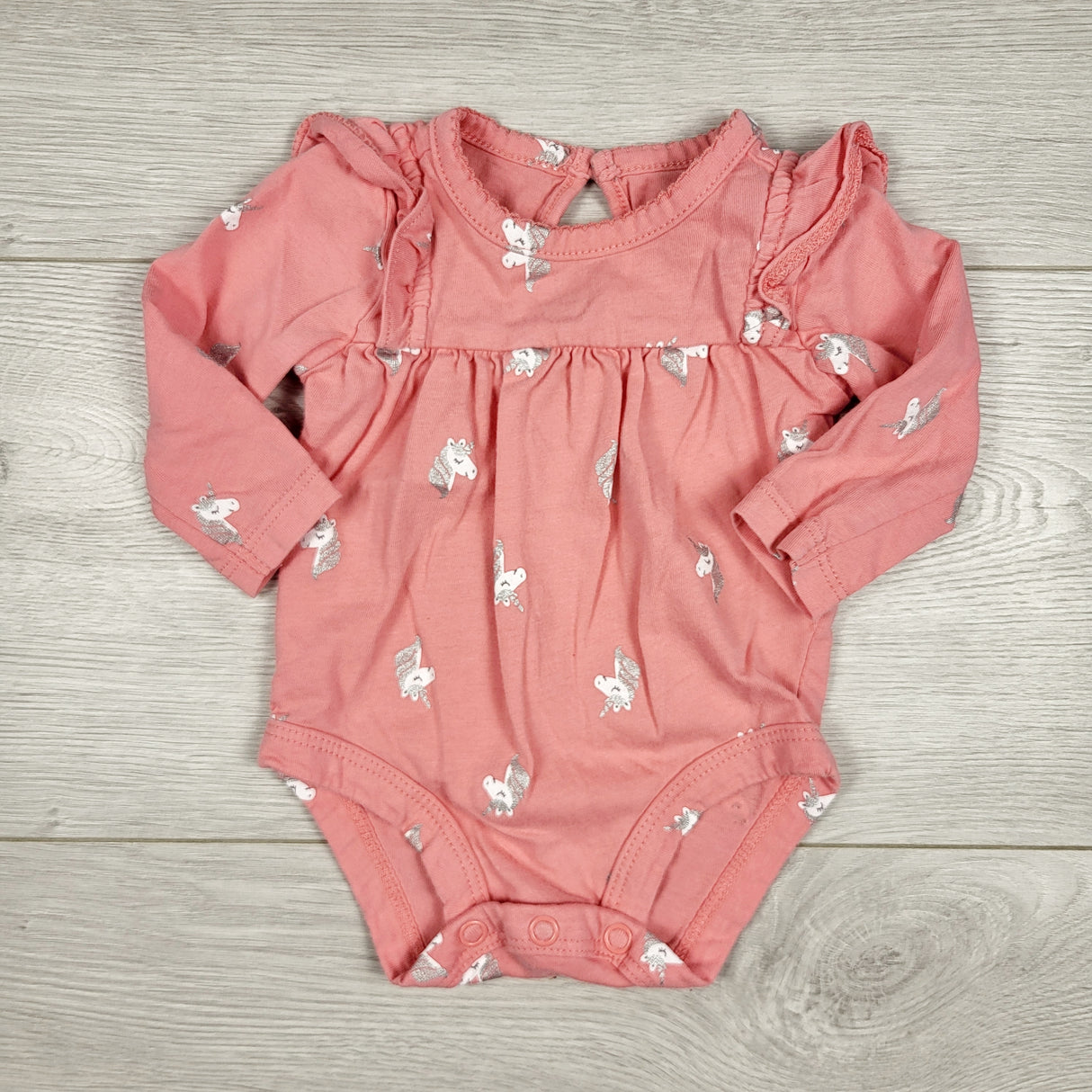 Carters pink bodysuit with unicorns. Newborn size