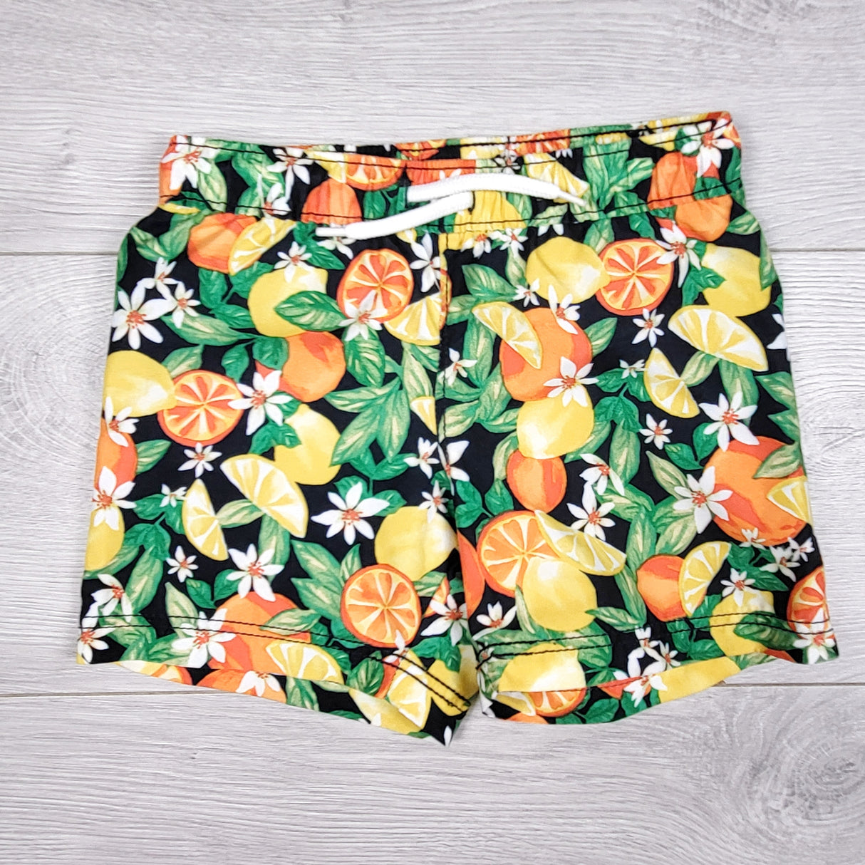 Old Navy swim shorts with citrus fruit. Size 18-24 months