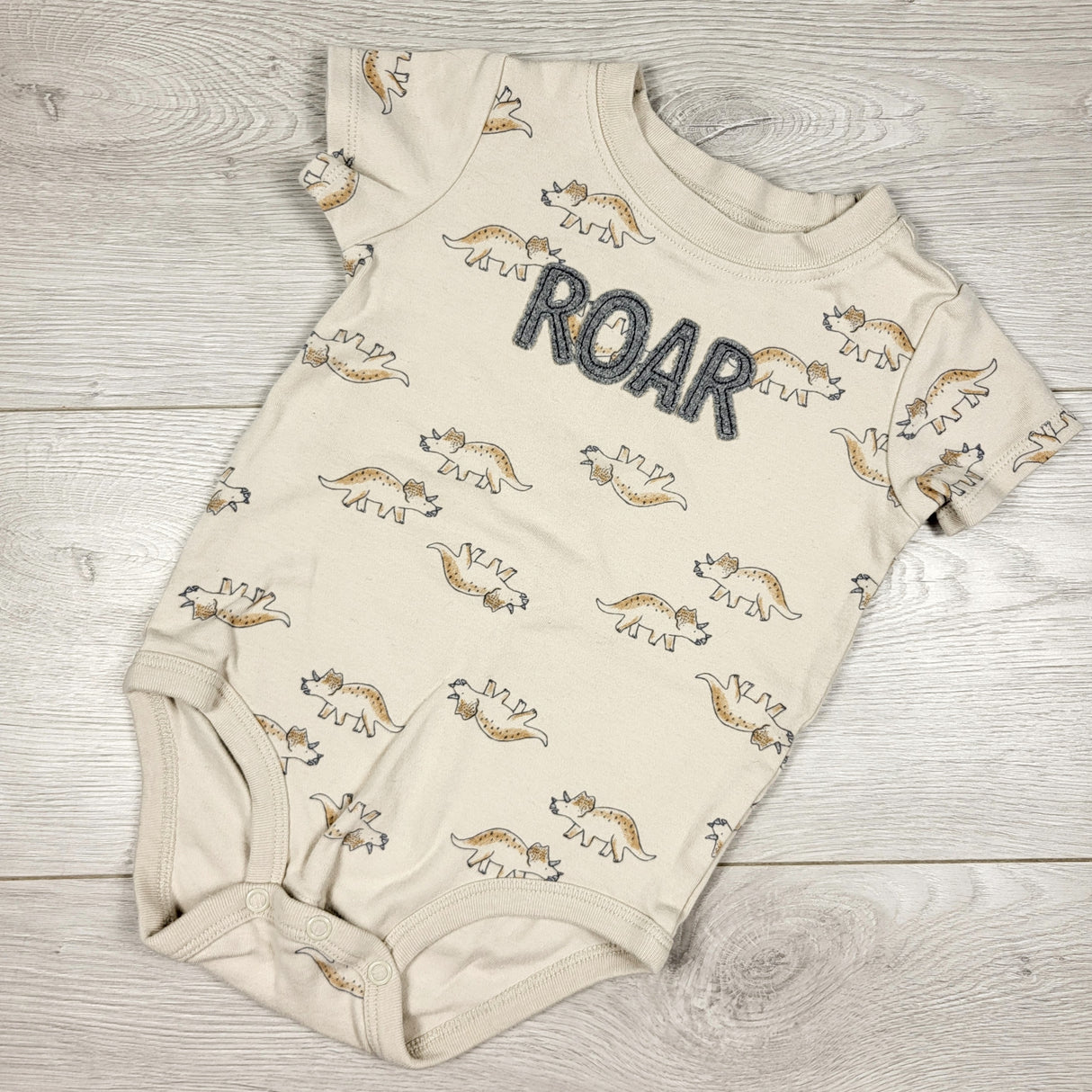 Child of Mine beige "Roar" bodysuit with dinosaurs. Size 18 months