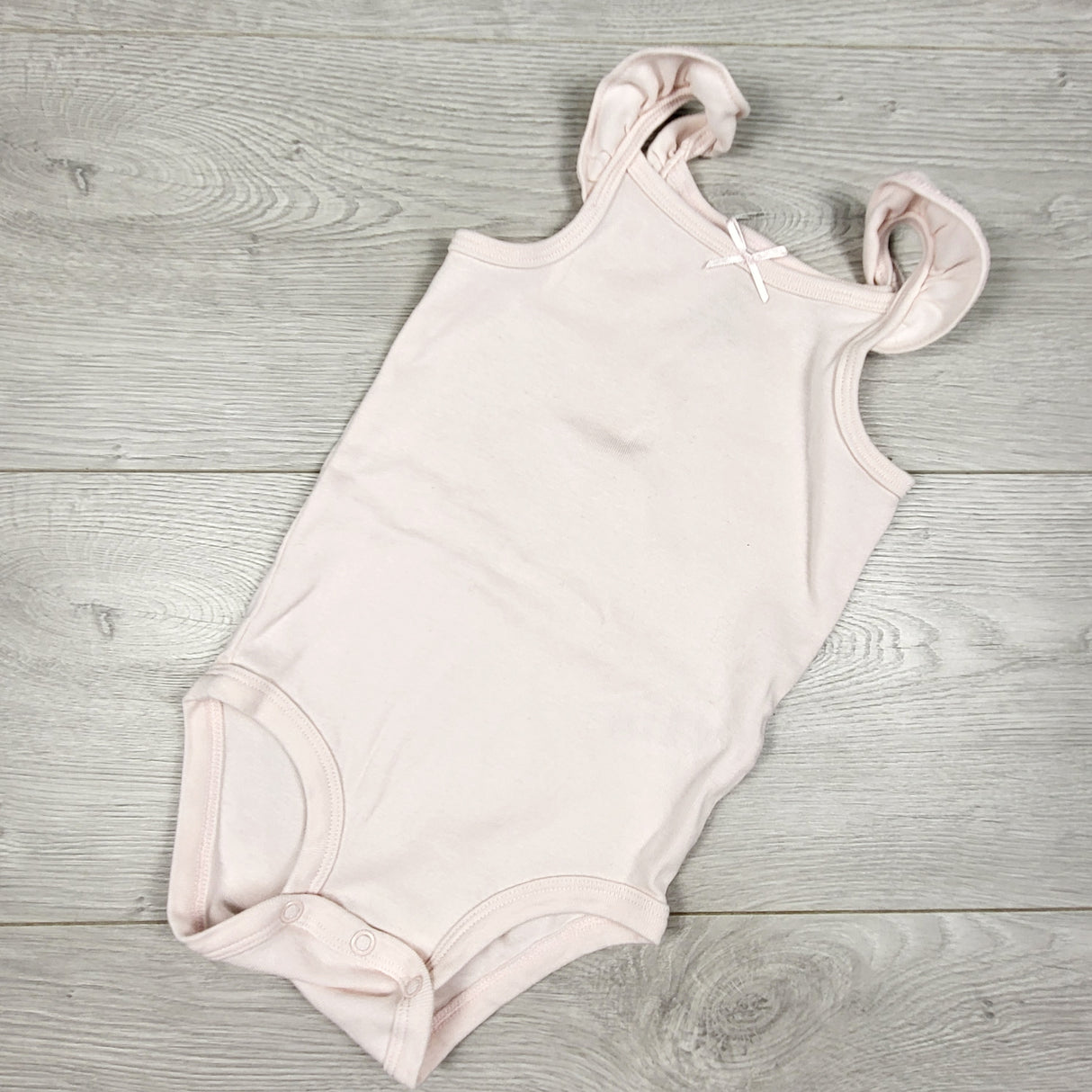 Carters light pink tank style bodysuit. Size 18 months