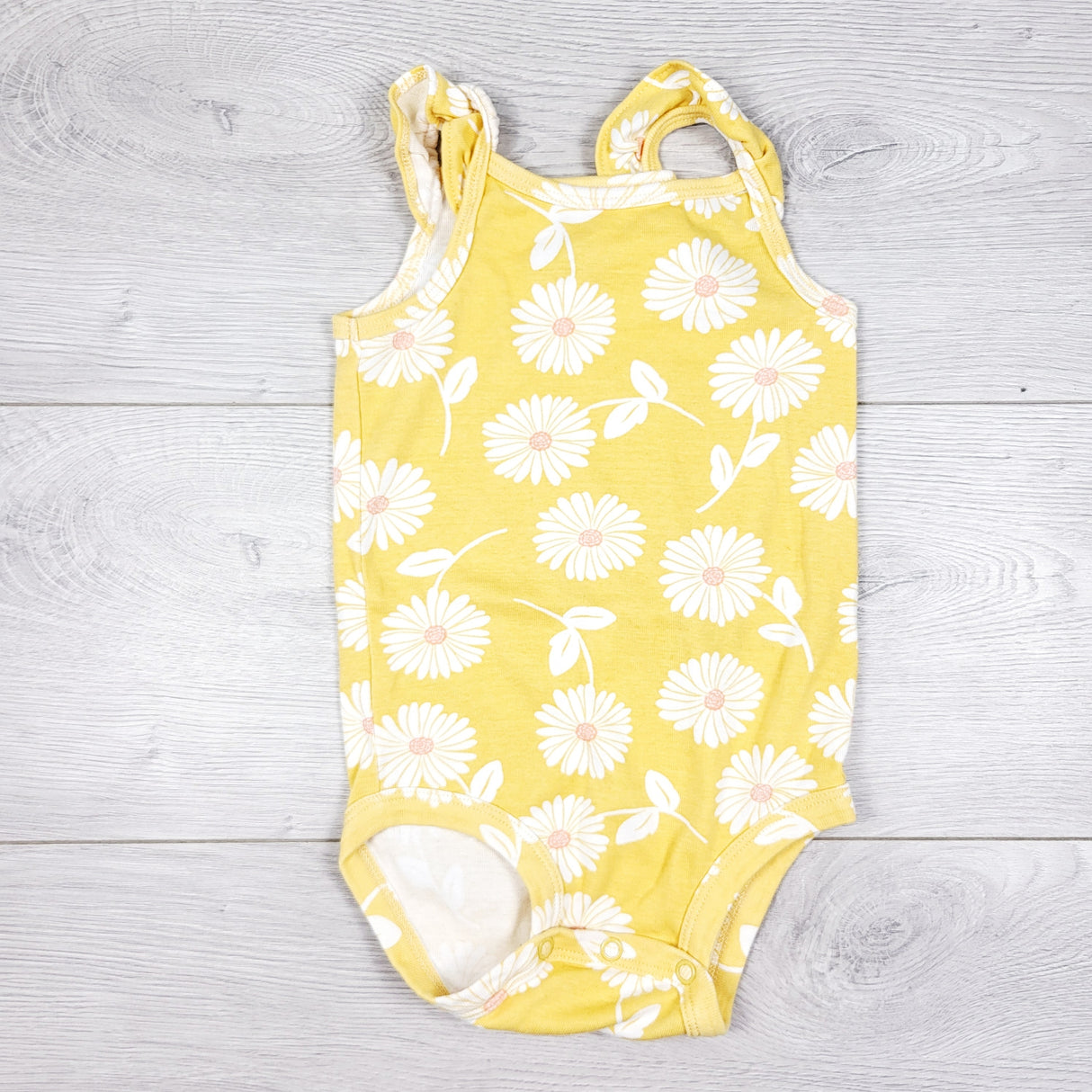 Carters yellow floral print tank style bodysuit. Size 18 months