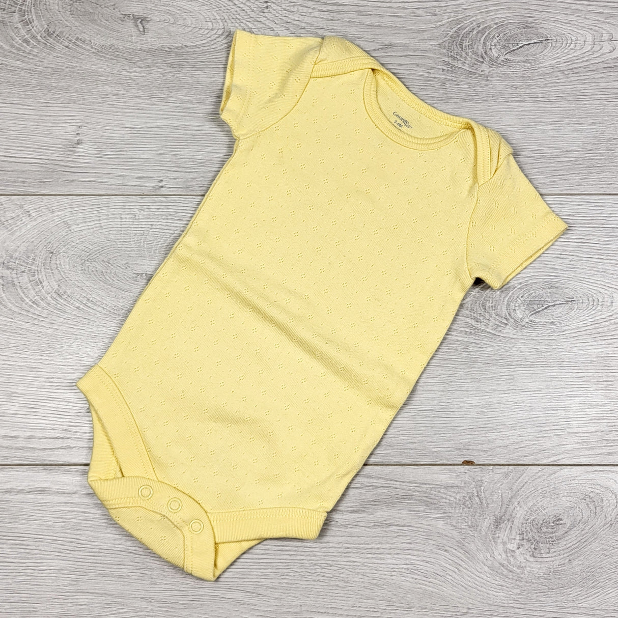George yellow bodysuit. Size 3-6 months