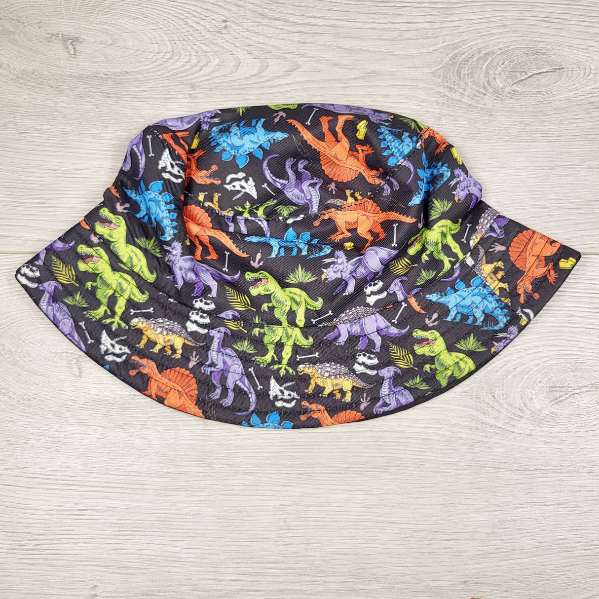 Black bucket hat with dinosaurs. Toddler sized