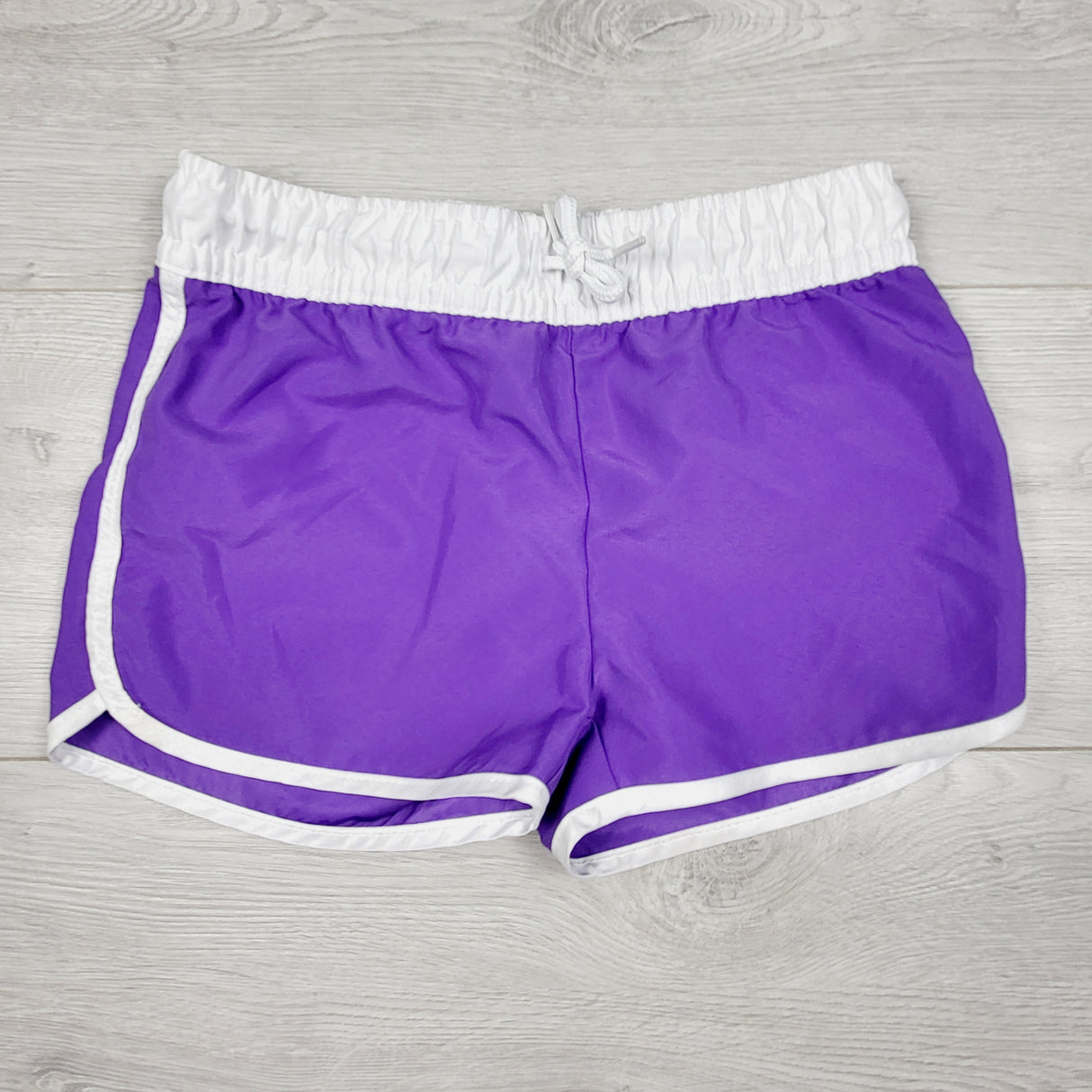 George purple and white swim shorts. Size 7/8