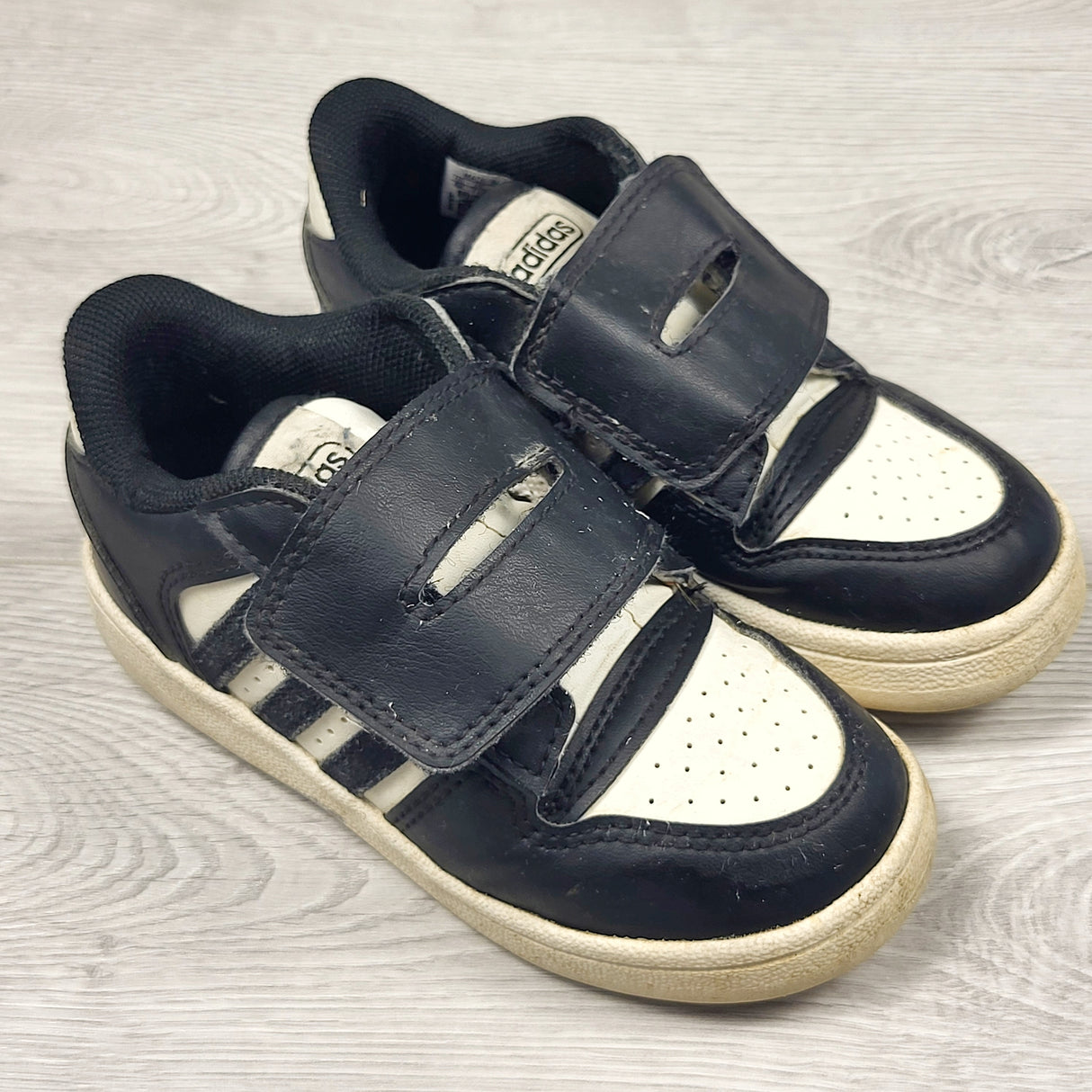 Adidas black and white leather running shoes. Size 8