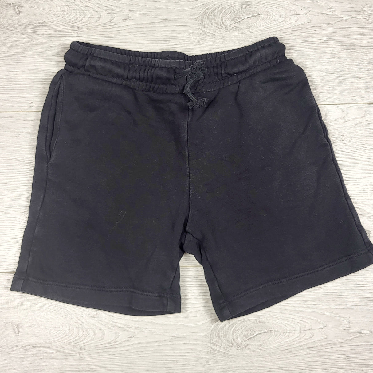 H and M black fleecy lined drawstring shorts. Size 4/5T