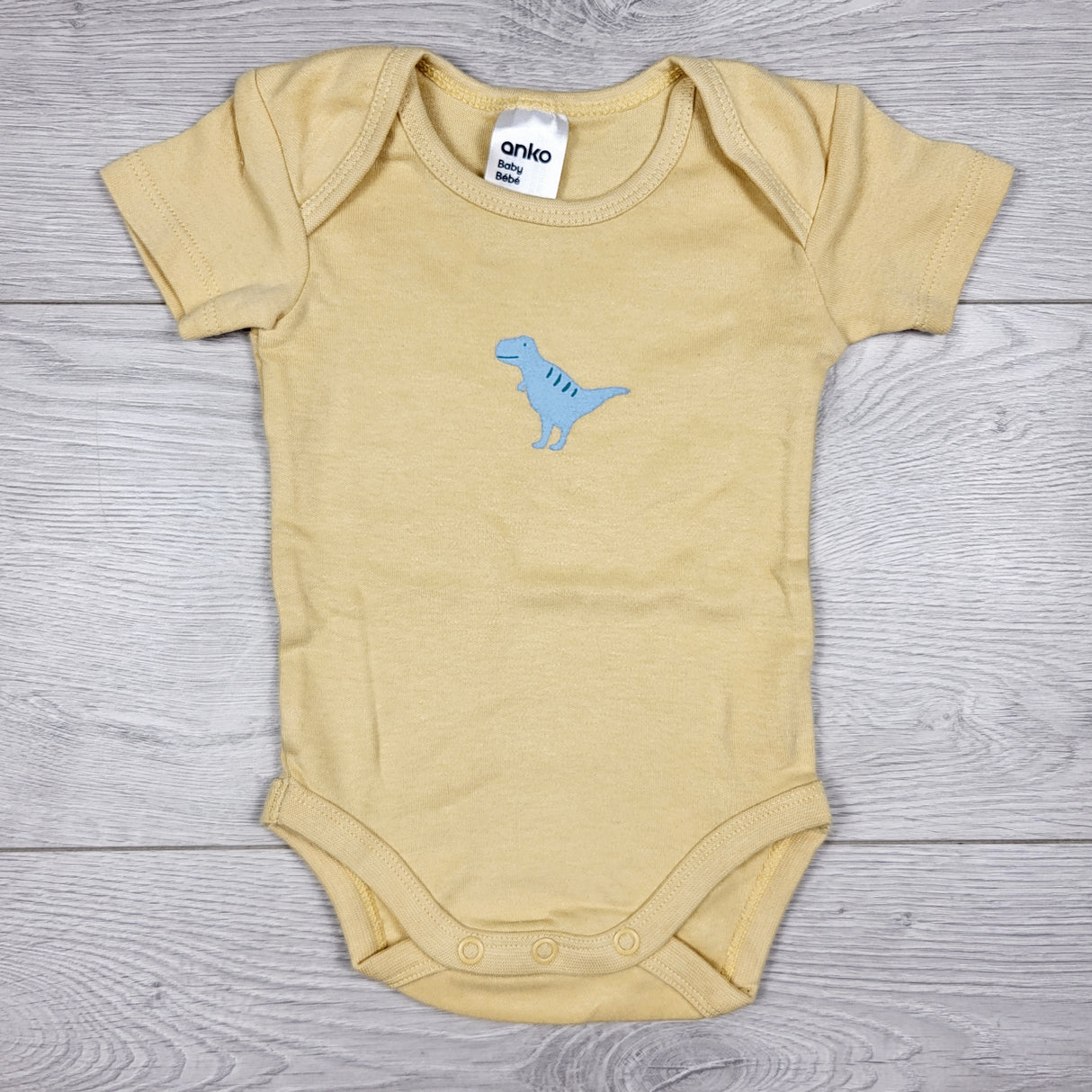 Anko yellow bodysuit with dinosaur. Size 0-3 months