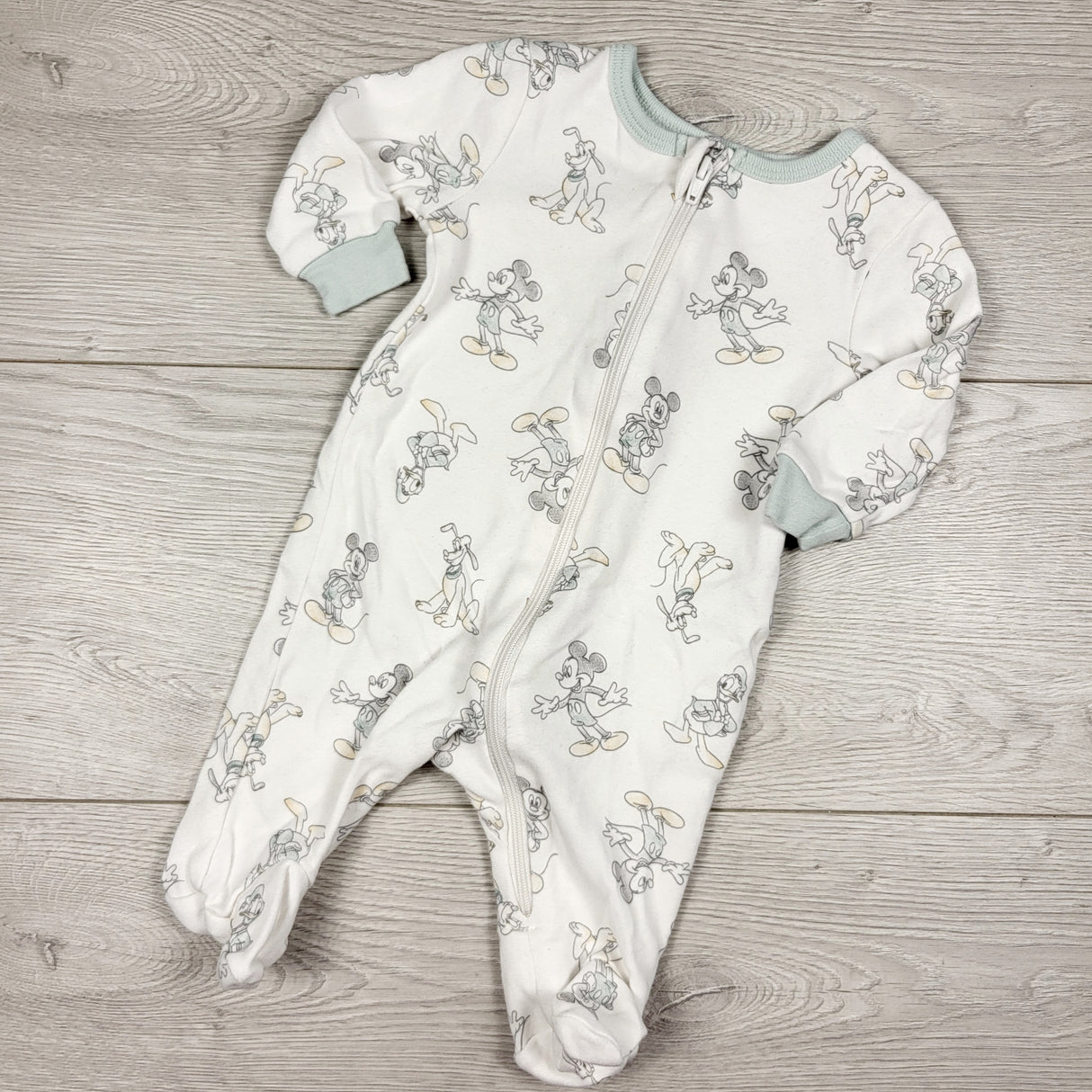 Disney white zippered sleeper with Disney characters. Newborn size