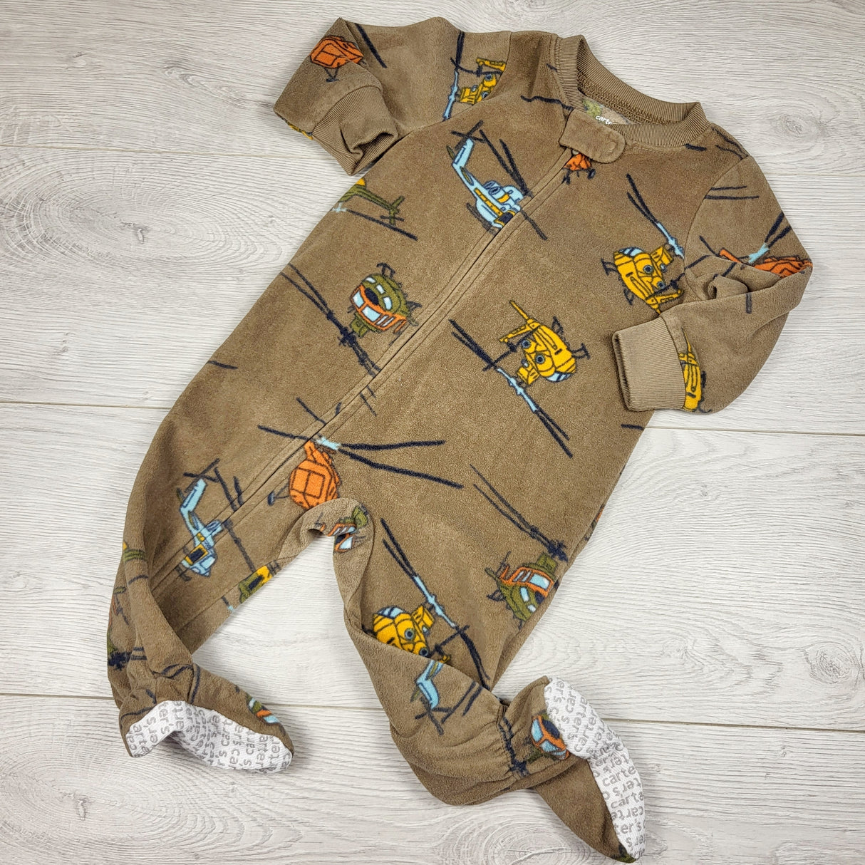Carters brown zippered fleece sleeper with helicopters. Size 9 months