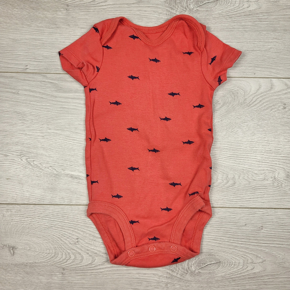 Child of Mine orangey-red bodysuit with sharks. Size 0-3 months