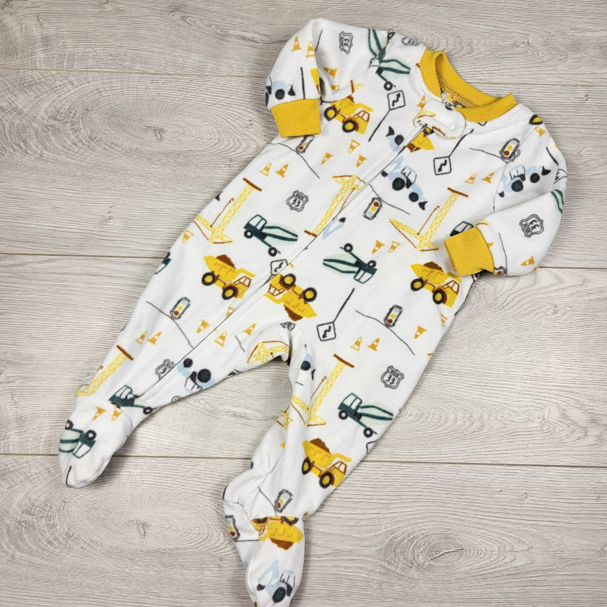 Carters white zippered fleece sleeper with construction theme. Size 3 months