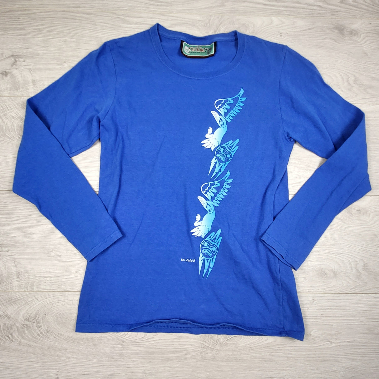 Aylelum blue long sleeved top with Indigenous design. ADULT size small