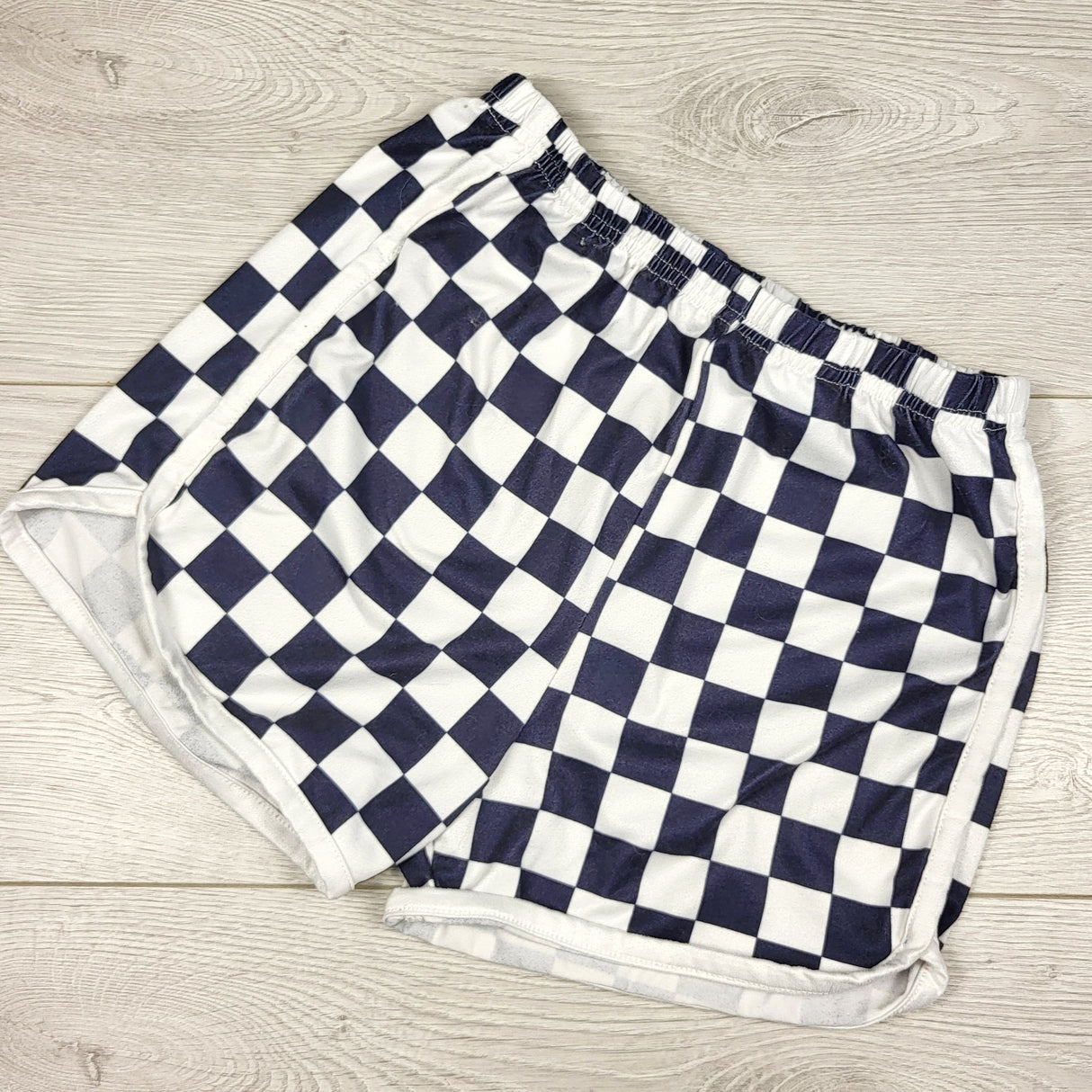 Black checked shorts. Size 7