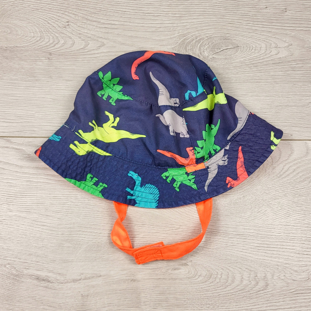 Reversible bucket hat with dinosaurs. Approx 0-12 months