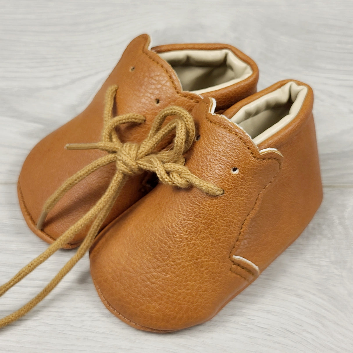 Brown soft soled shoes with bears. Infant size 1