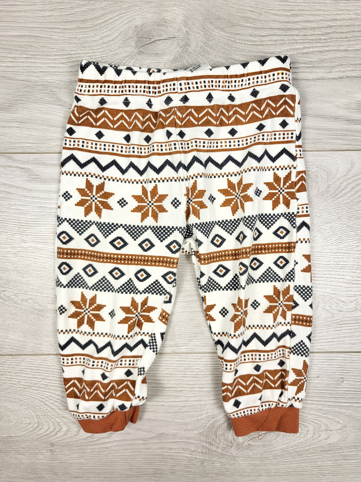 Pekkle white and tan patterned pants. Size 9 months