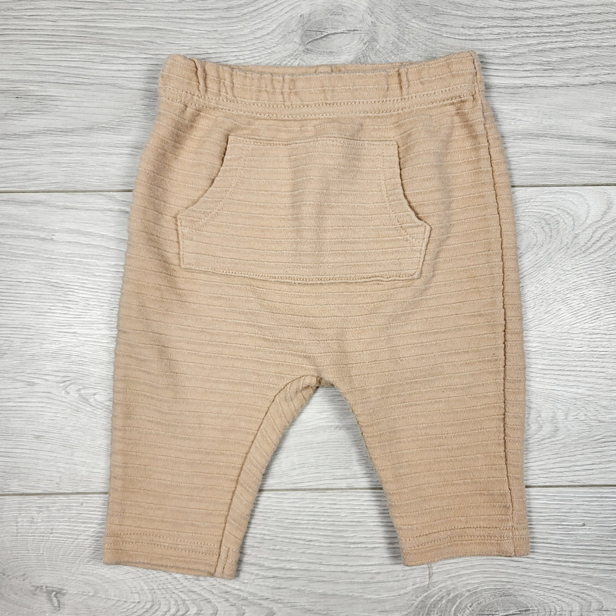 Disney beige textured pants. Size 3-6 months