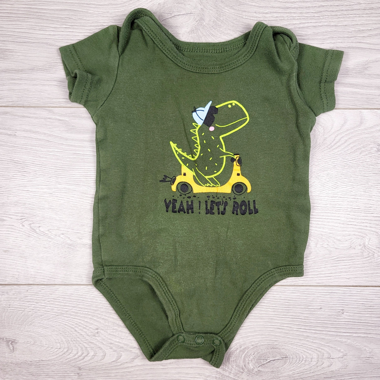 Monkey Bars green bodysuit with dinosaur. Size 12 months