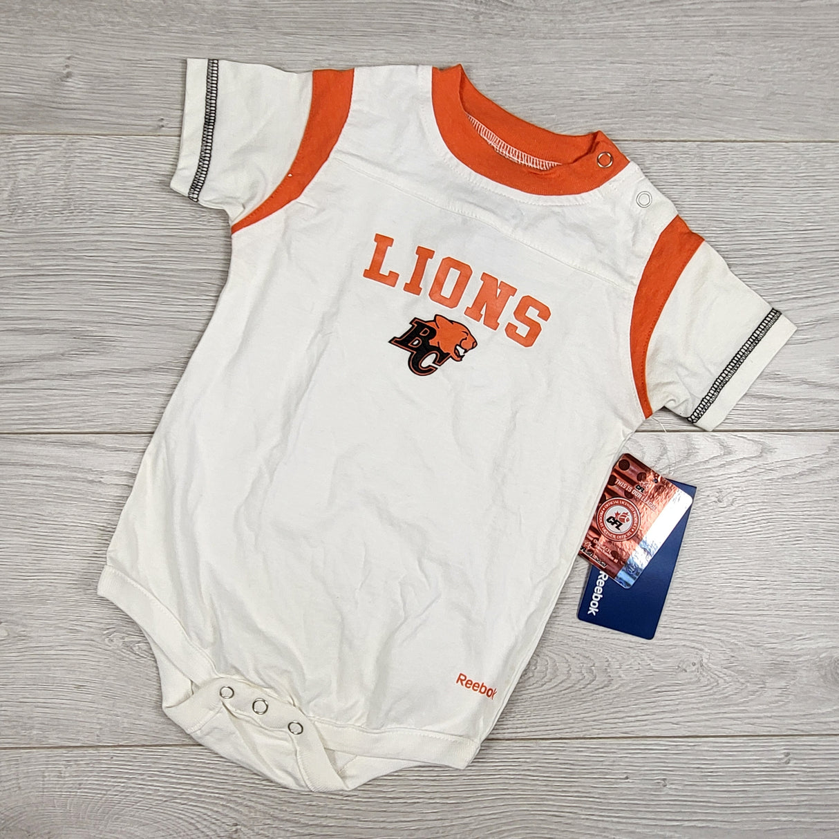 NEW - BC Lions bodysuit. Size 18 months